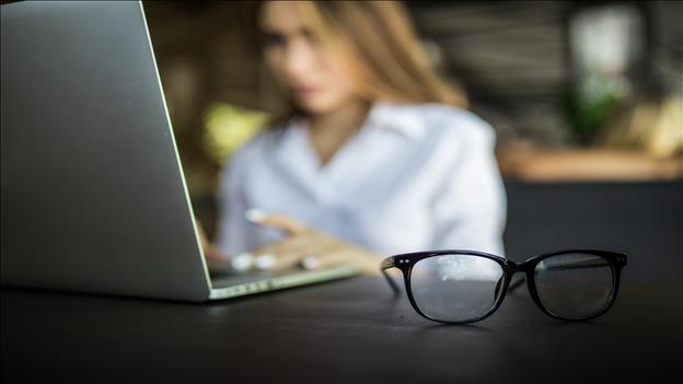 Woman with Hands on laptop